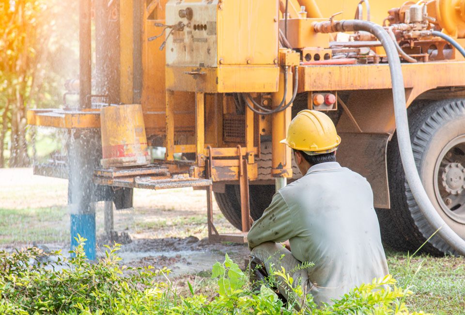 Licensed well driller at work beside the rig in Greater Wichita